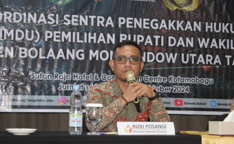 Plt. Ketua Bawaslu Bolmut Rizki Posangi, SH saat Sambutan Rakor Gakkumdu